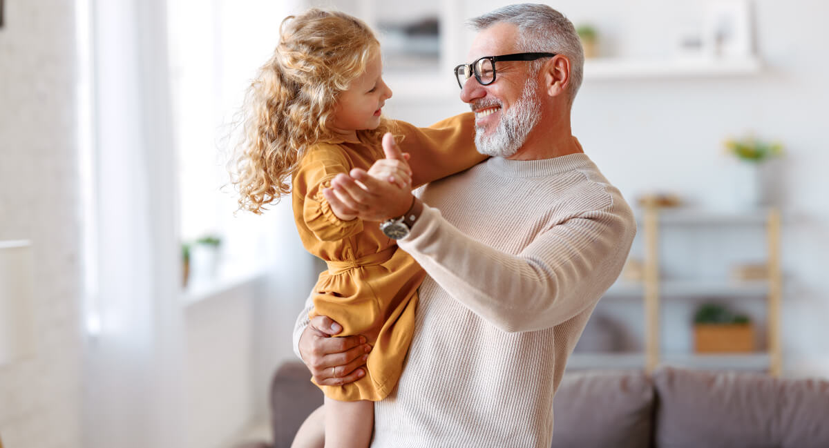 Grandpa and granddaughter dancing