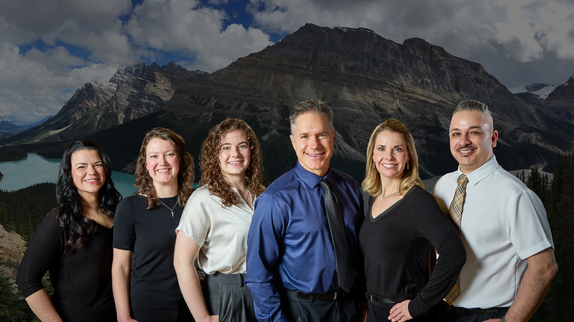 Our Beacon Hill Chiropractic and Massage team in front of a mountain photo