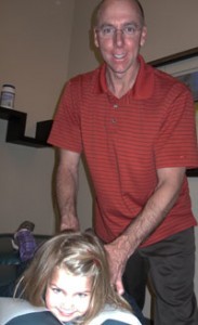 Dr. Hoffer adjusting a child