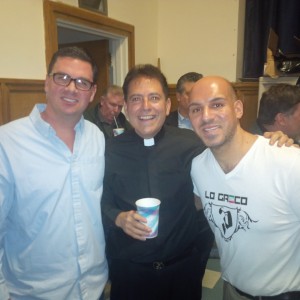 Dr. Baio , Msgr Jamie and John Landi taking in the fights . 