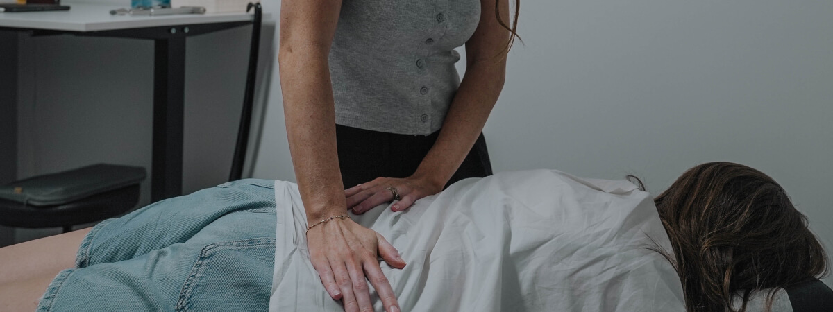Toowoomba chiropractor adjusting a patient's back