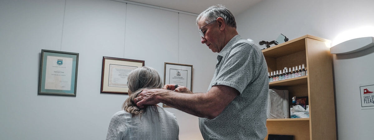 Toowoomba chiropractor adjusting a patient's neck