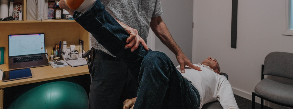 Toowoomba chiropractor adjusting a patient's leg