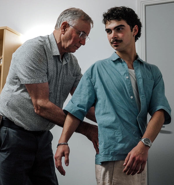 Toowoomba chiropractor adjusting a male patient's back