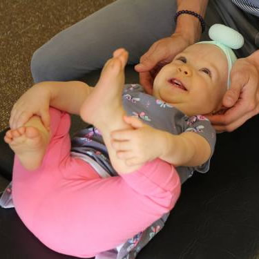 Baby getting adjusted on table