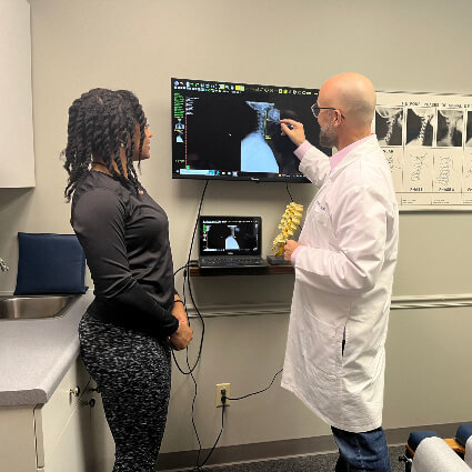 Dr Thad showing xrays to paitnet