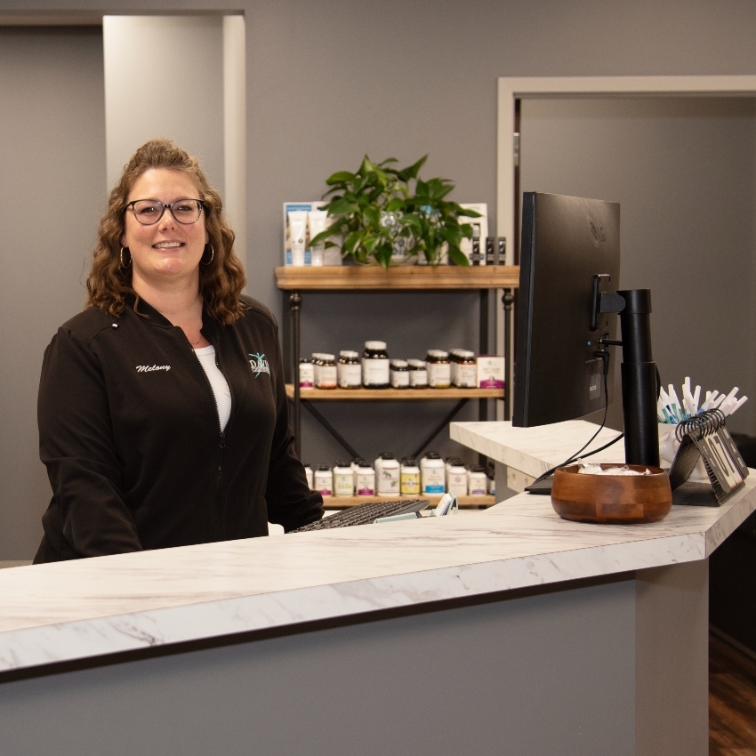 smiling front desk team member