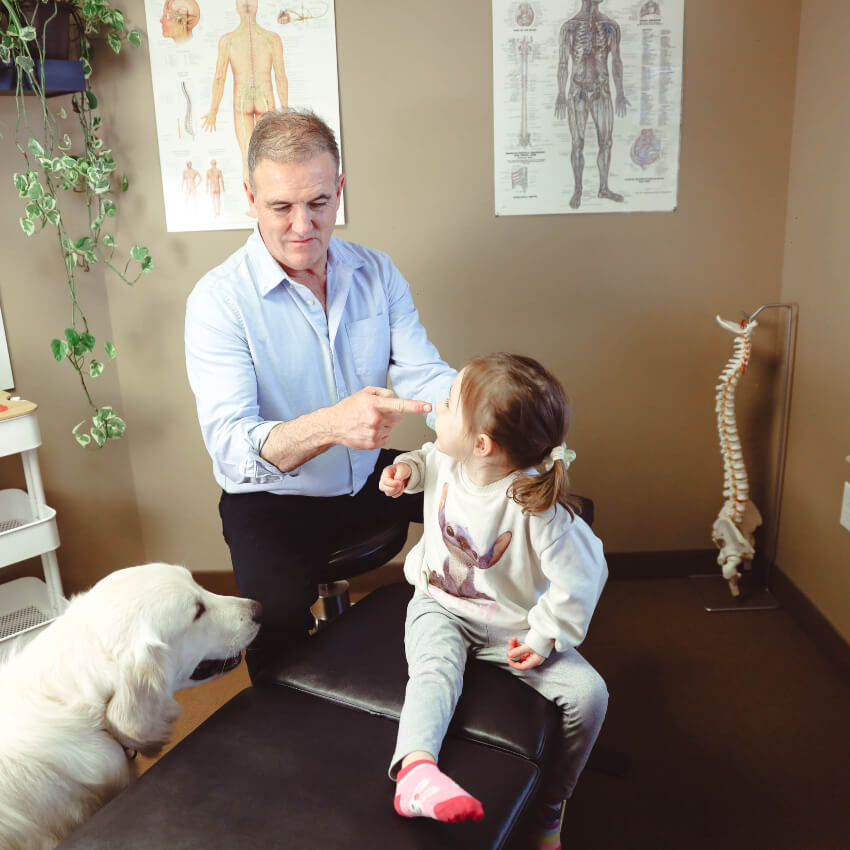 Saint John chiropractor Dr Gillis with child patient