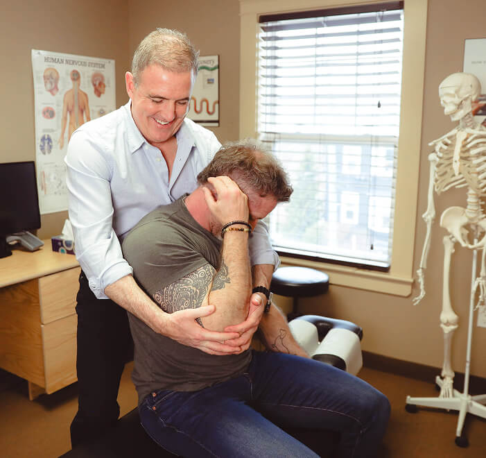 Dr. Gilis adjusting patient