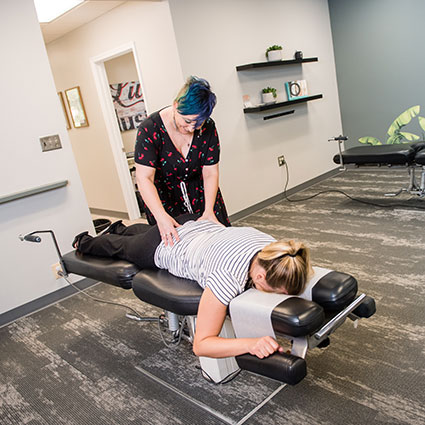 Adjusting womans lower back