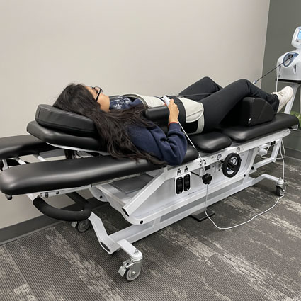 woman in spinal decompression machine
