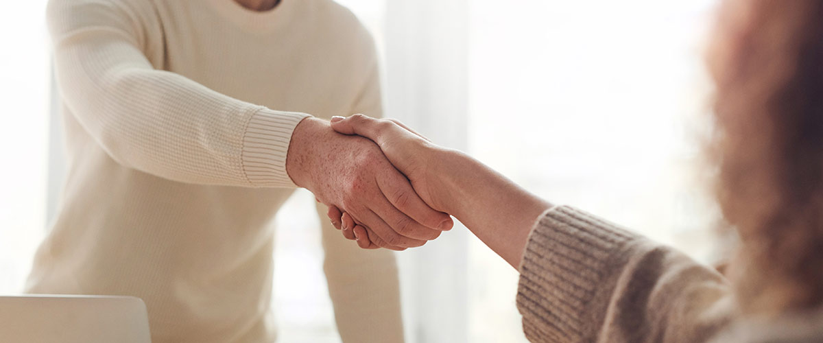 two people shaking hands