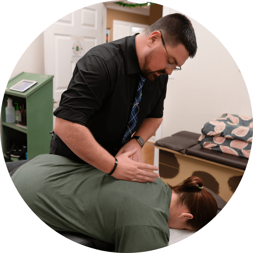 Dr. Ryan adjusting patient's back