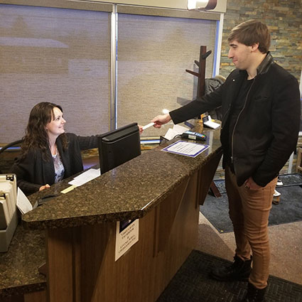 Man at reception desk