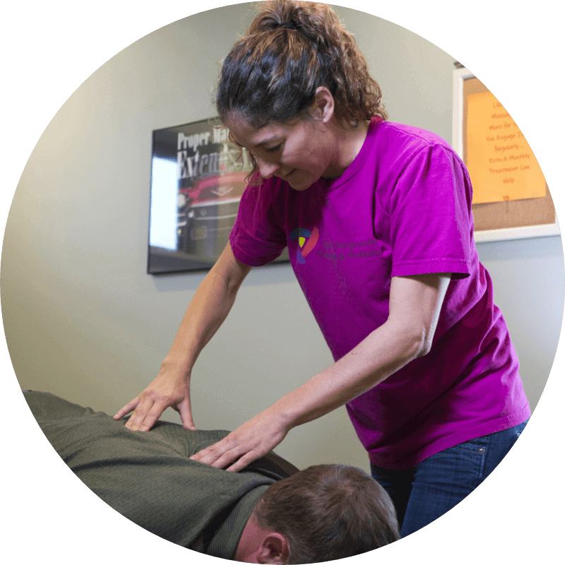 Atlas Chiropractic, Massage and Wellness Center massage therapist Raven Winn with patient