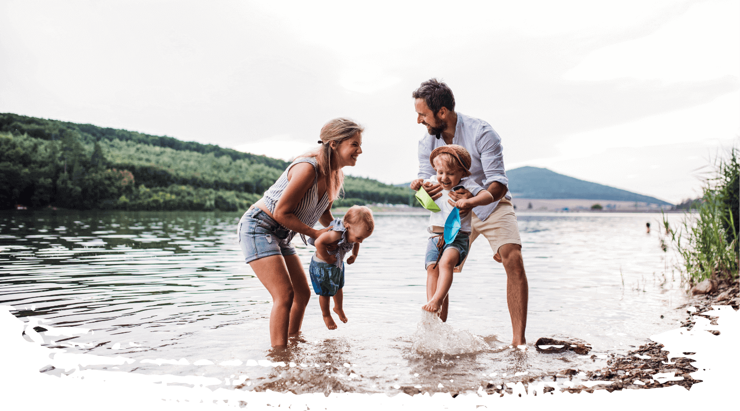 family playing in beach