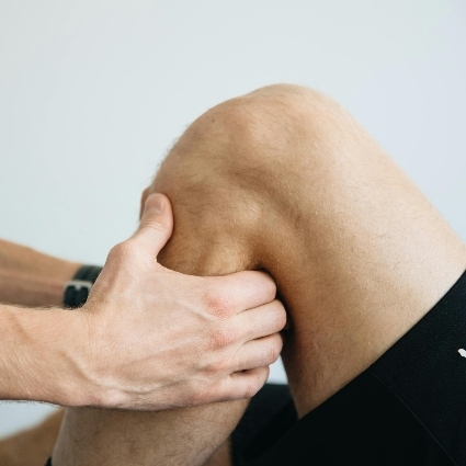 person having their knee adjusted