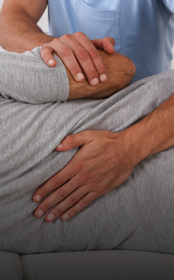 Chiropractor adjusting patient's back
