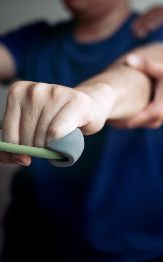 Chiropractor assisting patient with stretching exercises