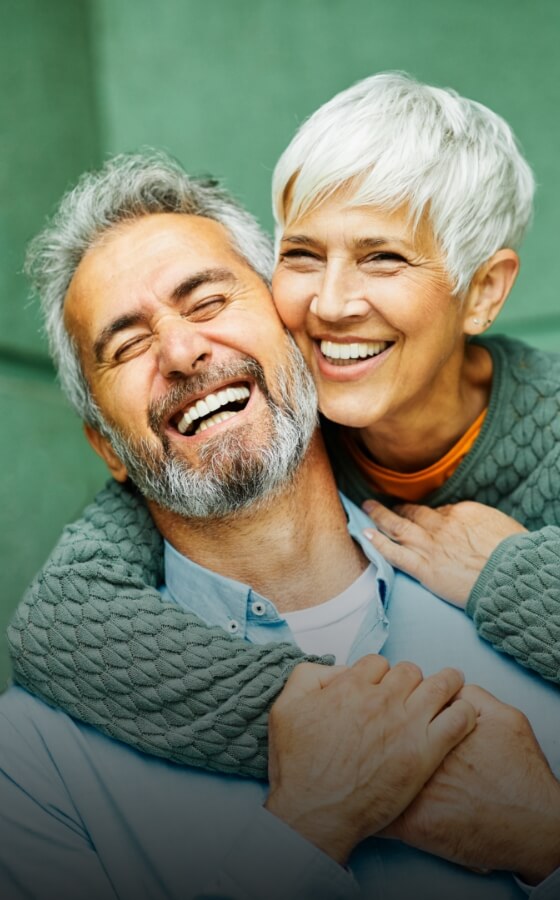 Smiling elderly man and woman