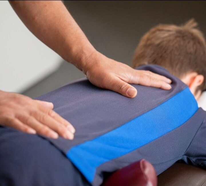 Keysborough chiropractor adjusting a young boy
