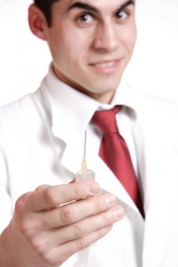 doctor holding a needle