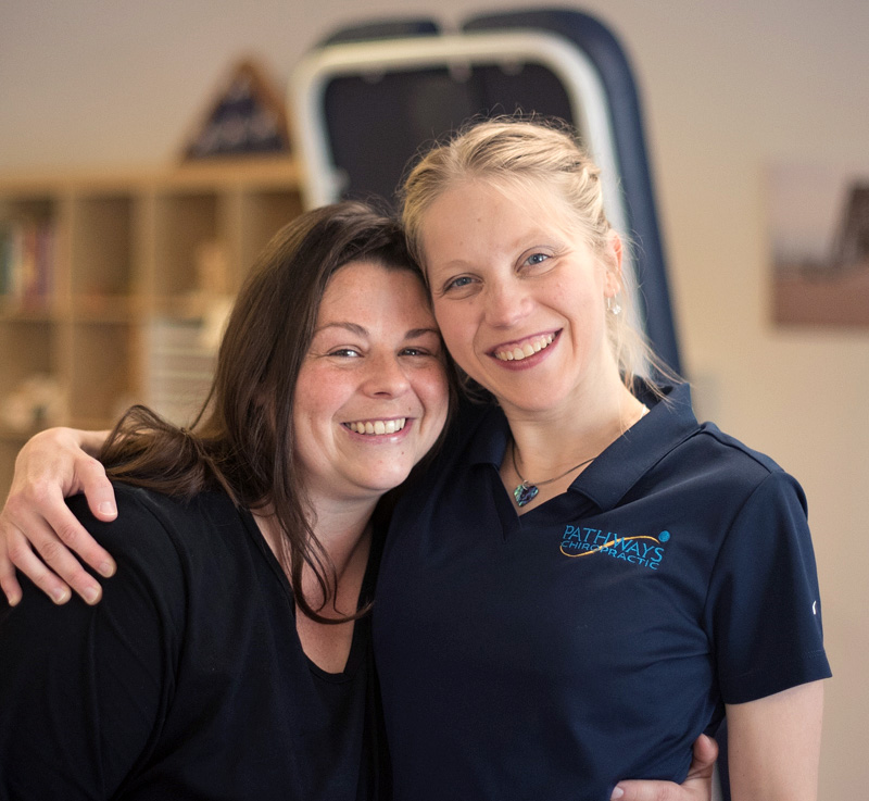 Dr. Hannah with arm around patient