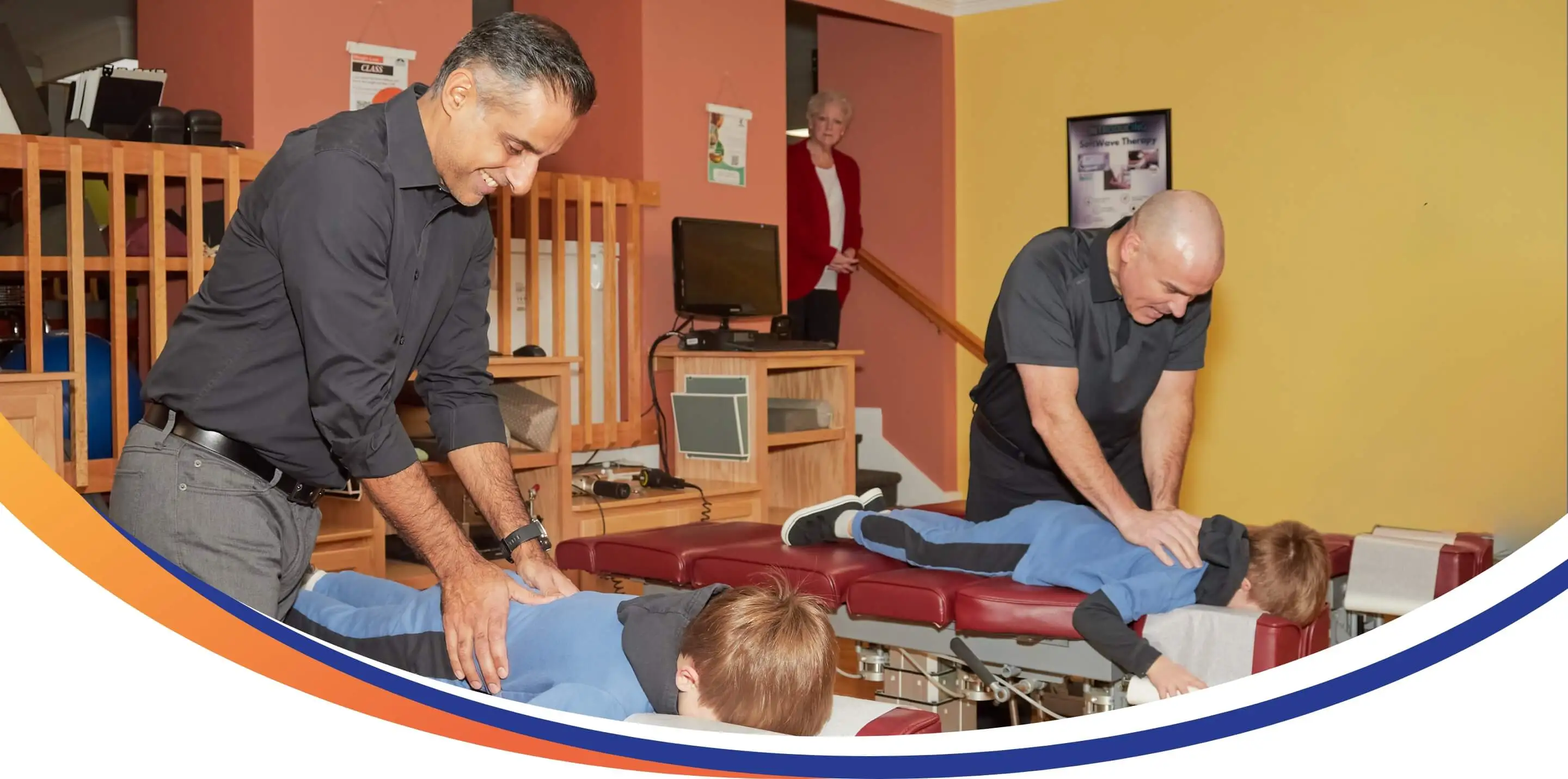Chiropractors adjusting patients