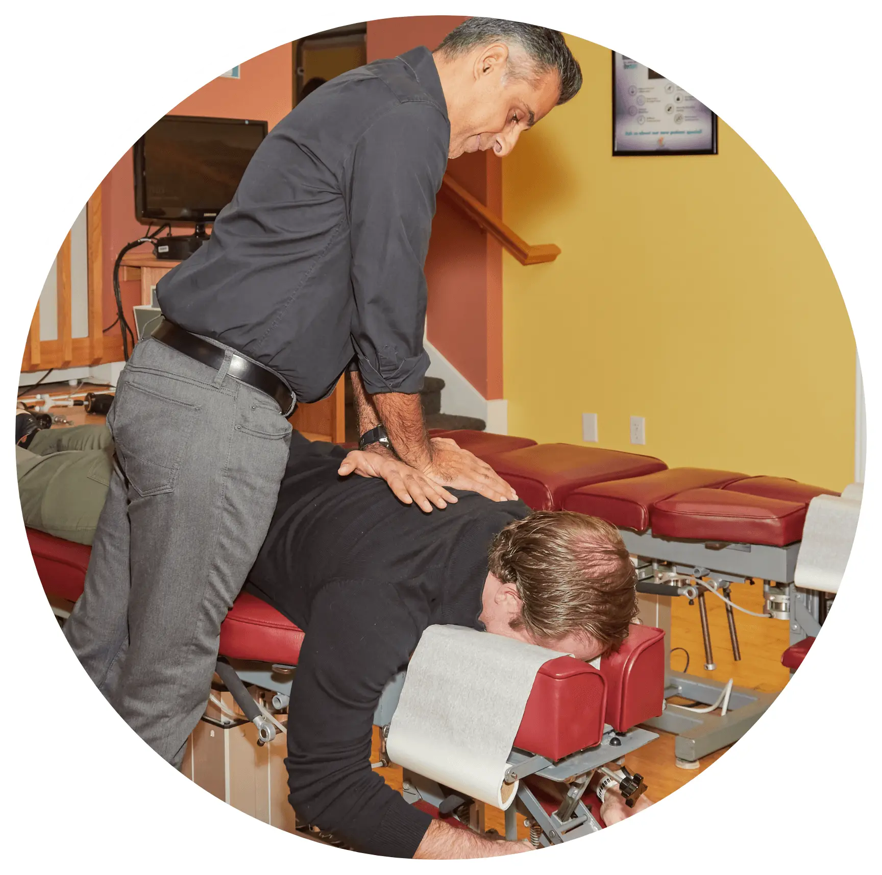 Chiropractor adjusting a patient