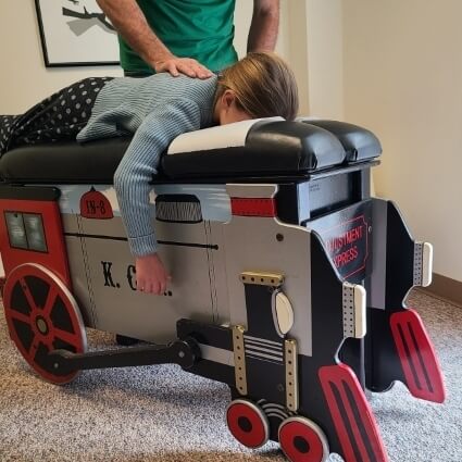 child on adjusting table