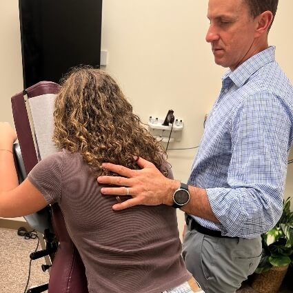 Dr houtz adjusting patients back
