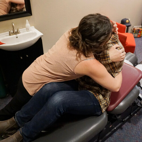 Male patient receiving a chiropractic adjustment