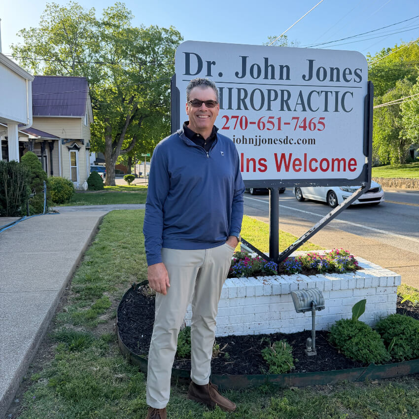 Dr. John Jones standing outside the office