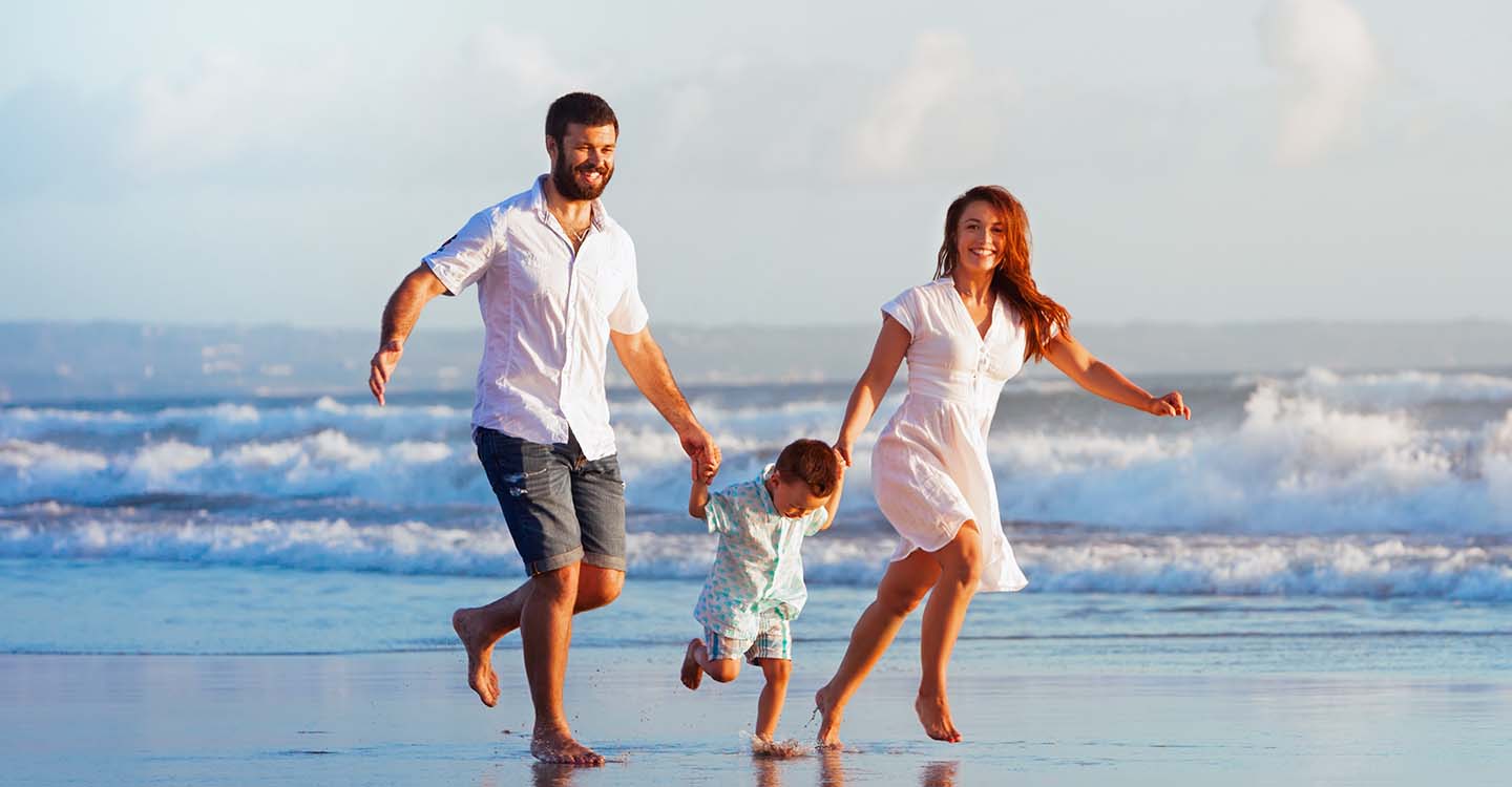 Family running beach