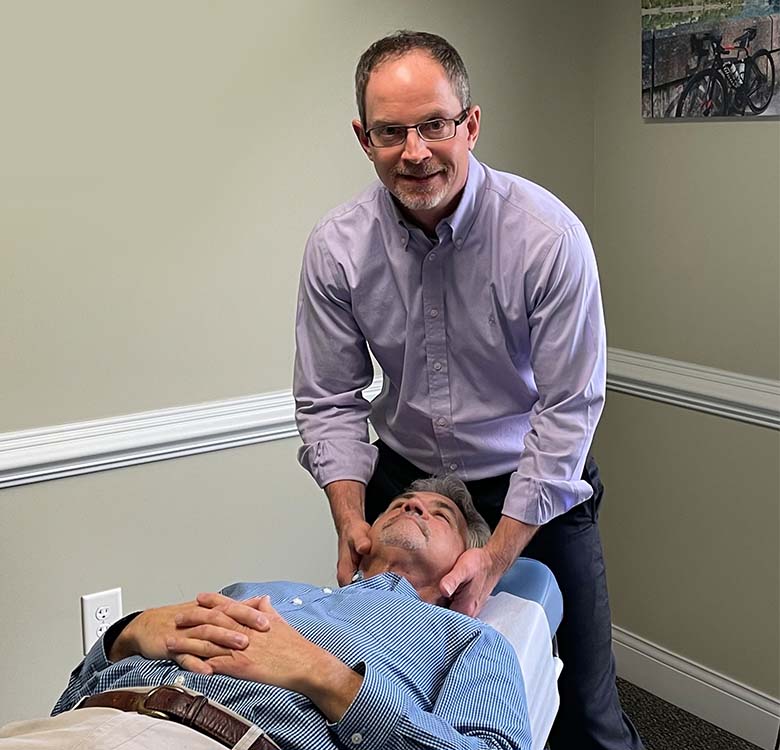 Dr Chris adjusting a patient