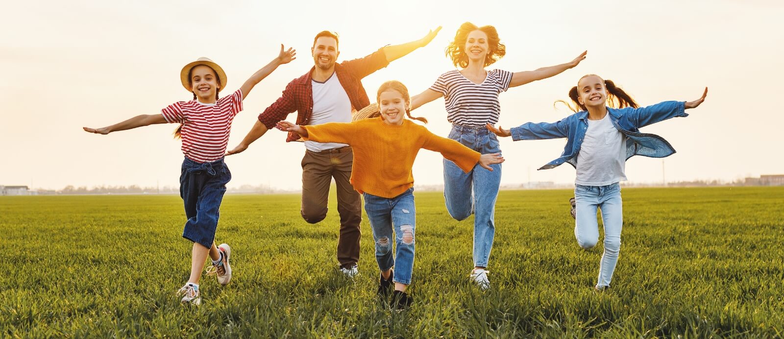 family running in a field