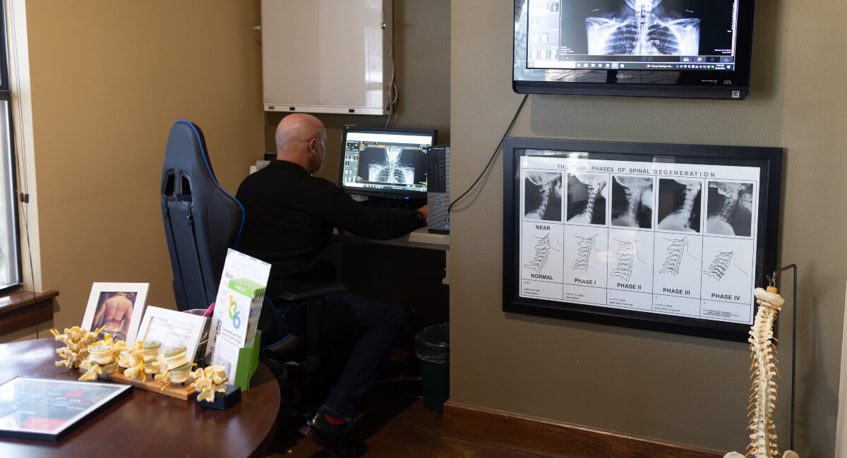 Dr. Derrick Houghton examining an x-ray