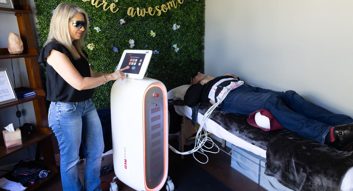 Texas Family Chiropractic staff operating invisared machine