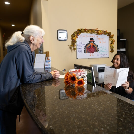 Texas Family Chiropractic patient at the reception desk
