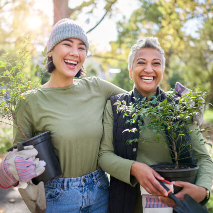 Two smiling women in garden