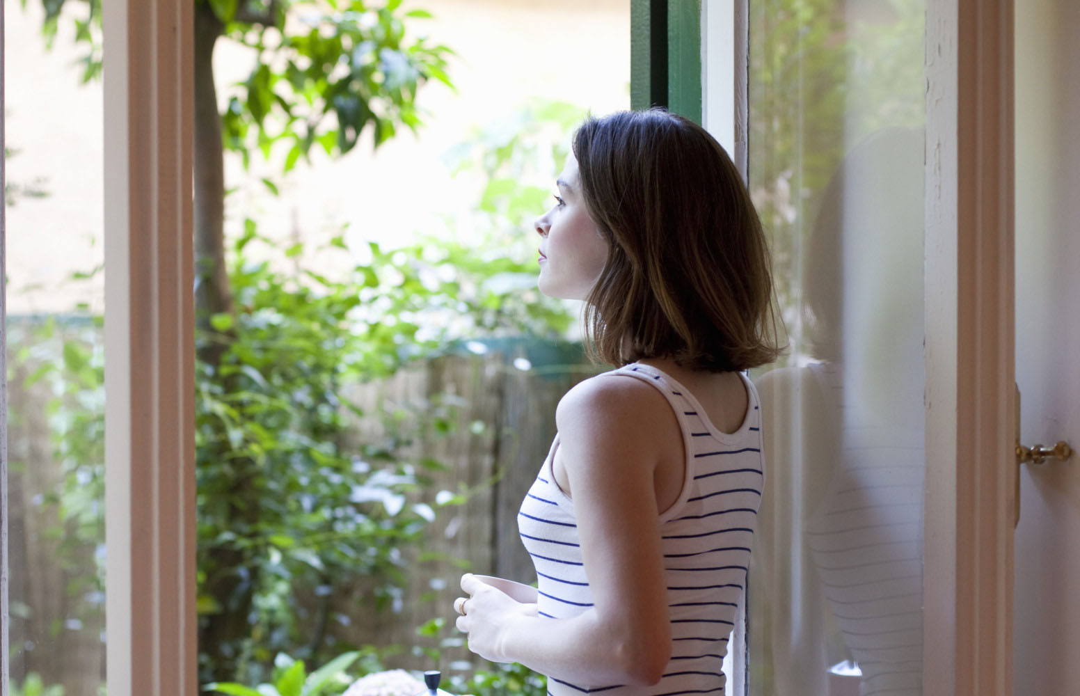 Woman looking out of Window