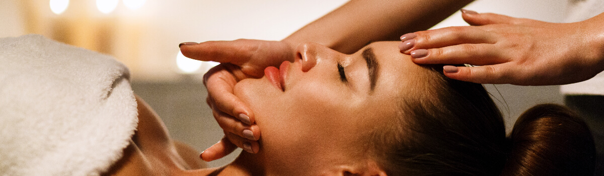 Woman enjoying facial massage