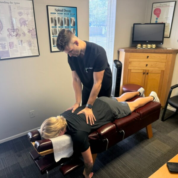 Upper-back adjustment for female patient