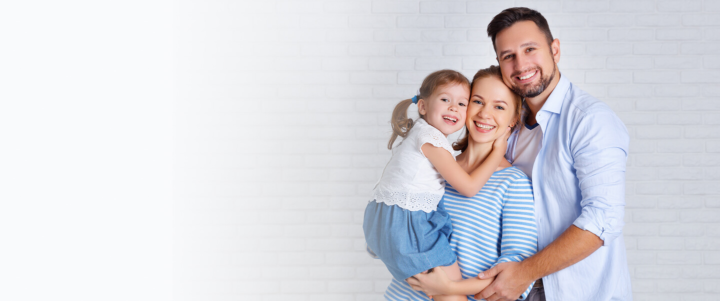 Smiling family of three
