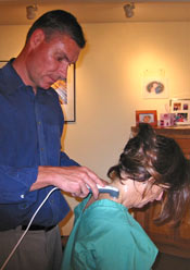 Arcadia Chiropractor Dr. Paul van Berkel administers Therapeutic Ultrasound to a patient.