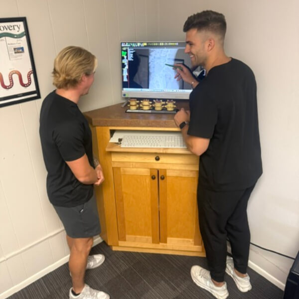 Chiropractor pointing at x-ray