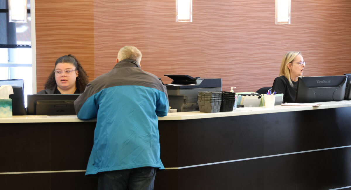 Patient filling out workers compensation intake forms