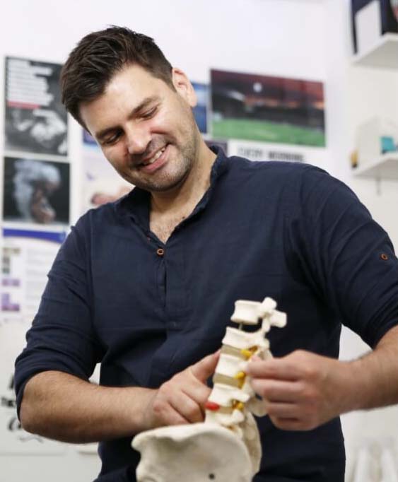 Dr. Roddy showing spine to patient