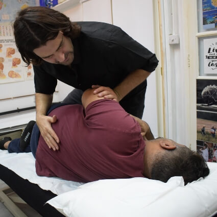 Dr Roddy adjusting patients back