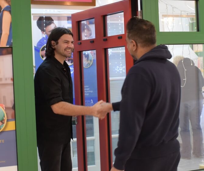 Dr Roddy shaking patients hand